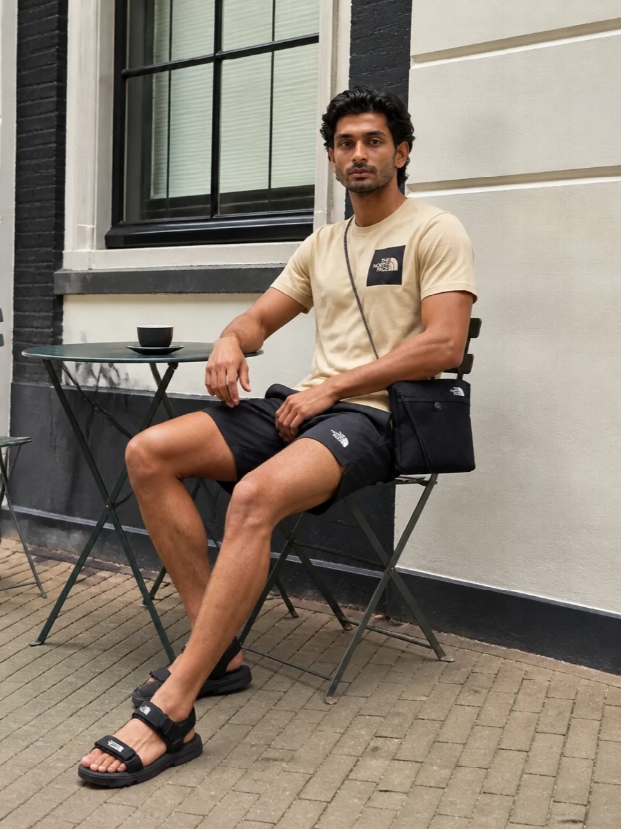 North face beige tshirt black shorts outfit