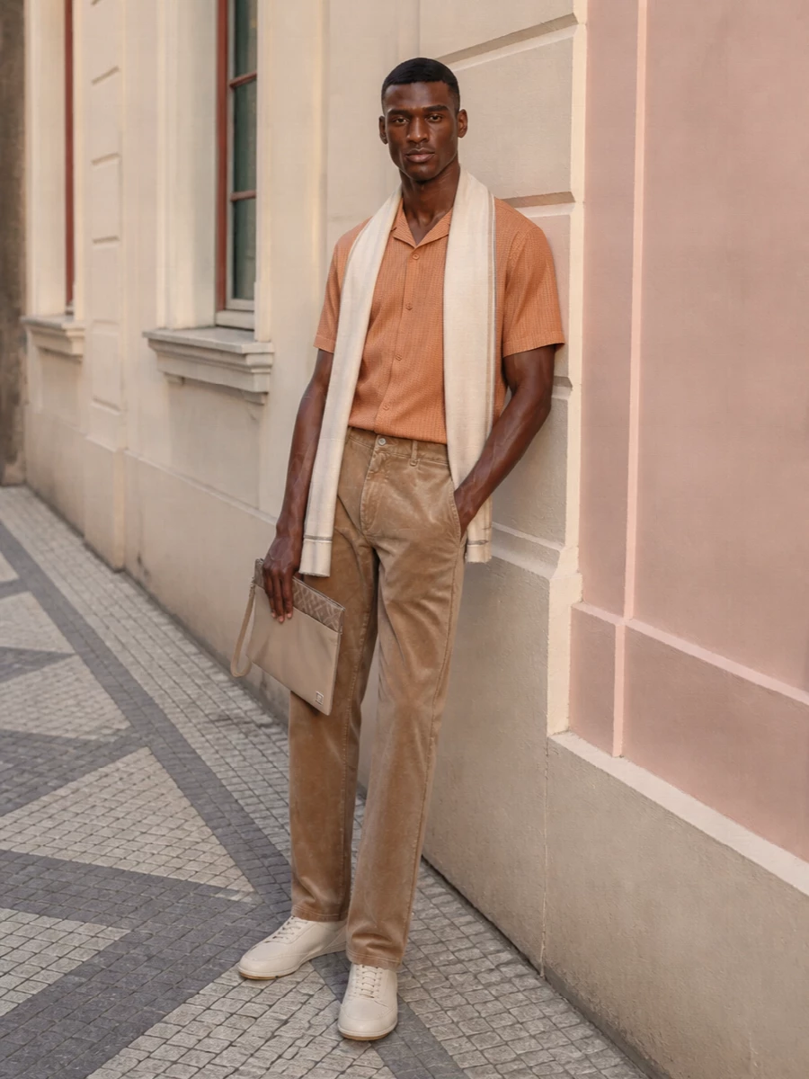 Fendi orange shirt camel jeans cream sneakers