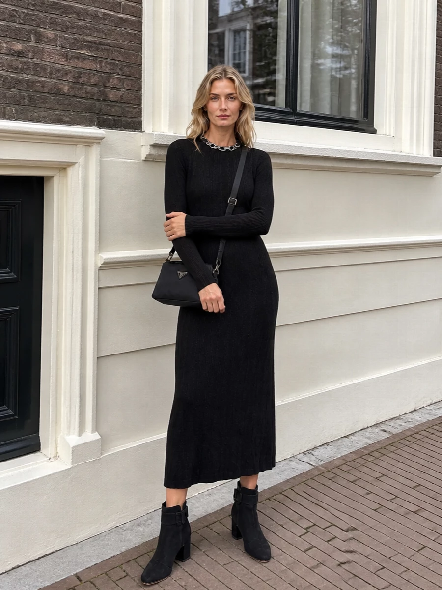 This is a pared back, city evening ensemble built around a single long, clean black line and subtle hardware. The ribbed Paco Rabanne midi dress and Prada cross-body share that polished, utilitarian minimalism, while the Roger Vivier ankle boots add just enough structure to ground the length without breaking the silhouette. Choosing the dress path keeps everything deliberately streamlined, letting texture and proportion do the work instead of extra separates.