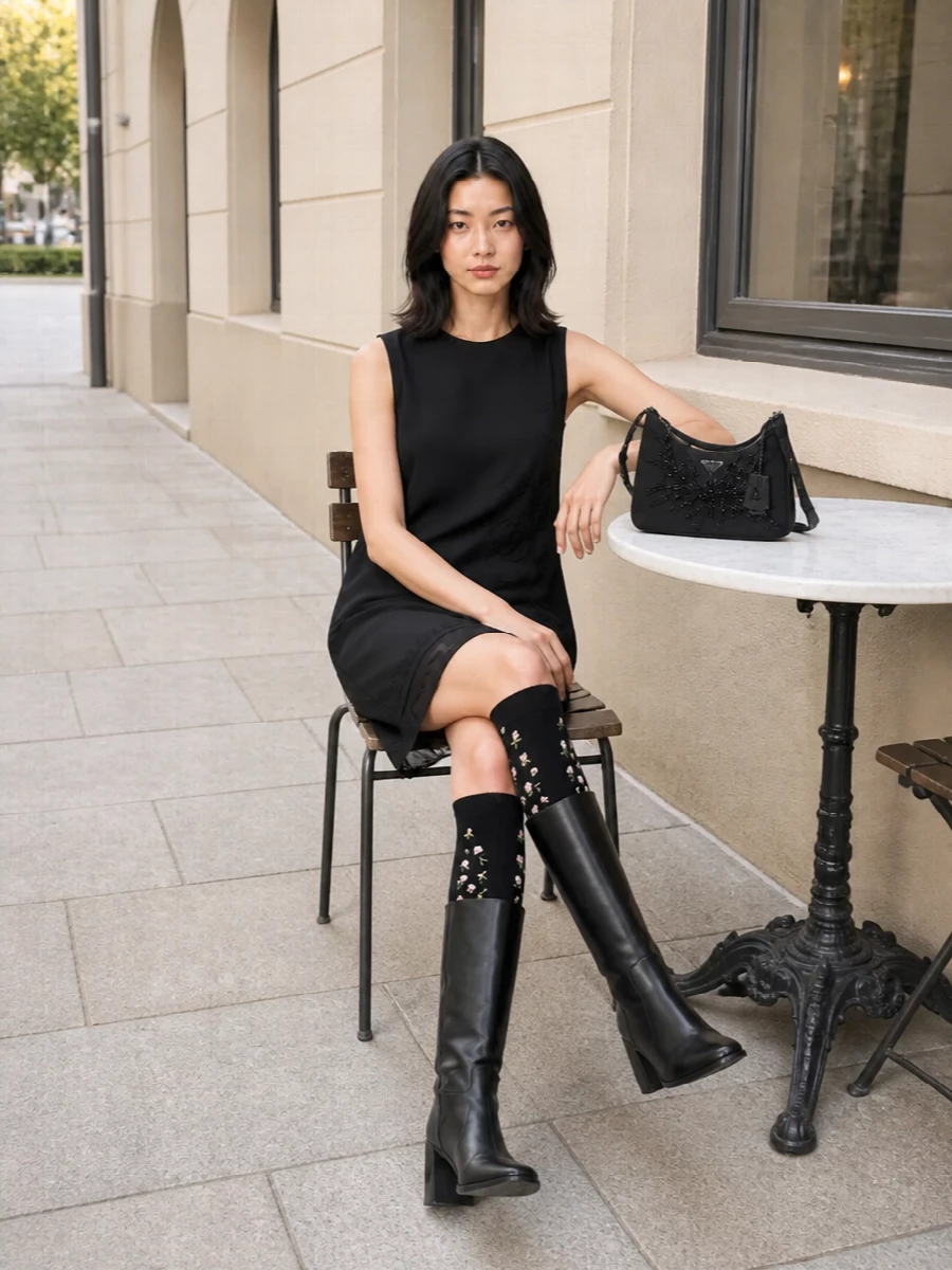 Prada black shift dress knee boots outfit