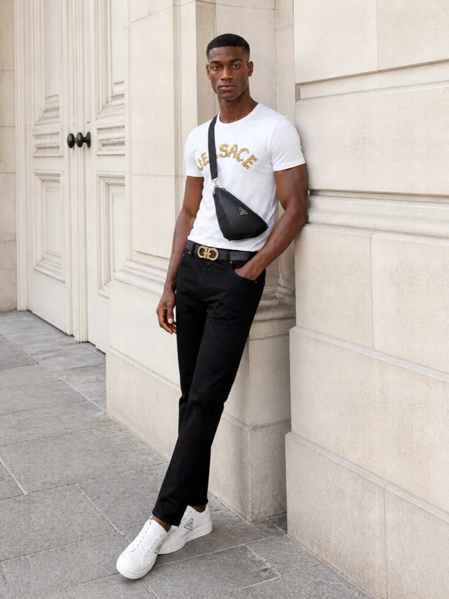 Versace gold logo tshirt black trousers outfit
