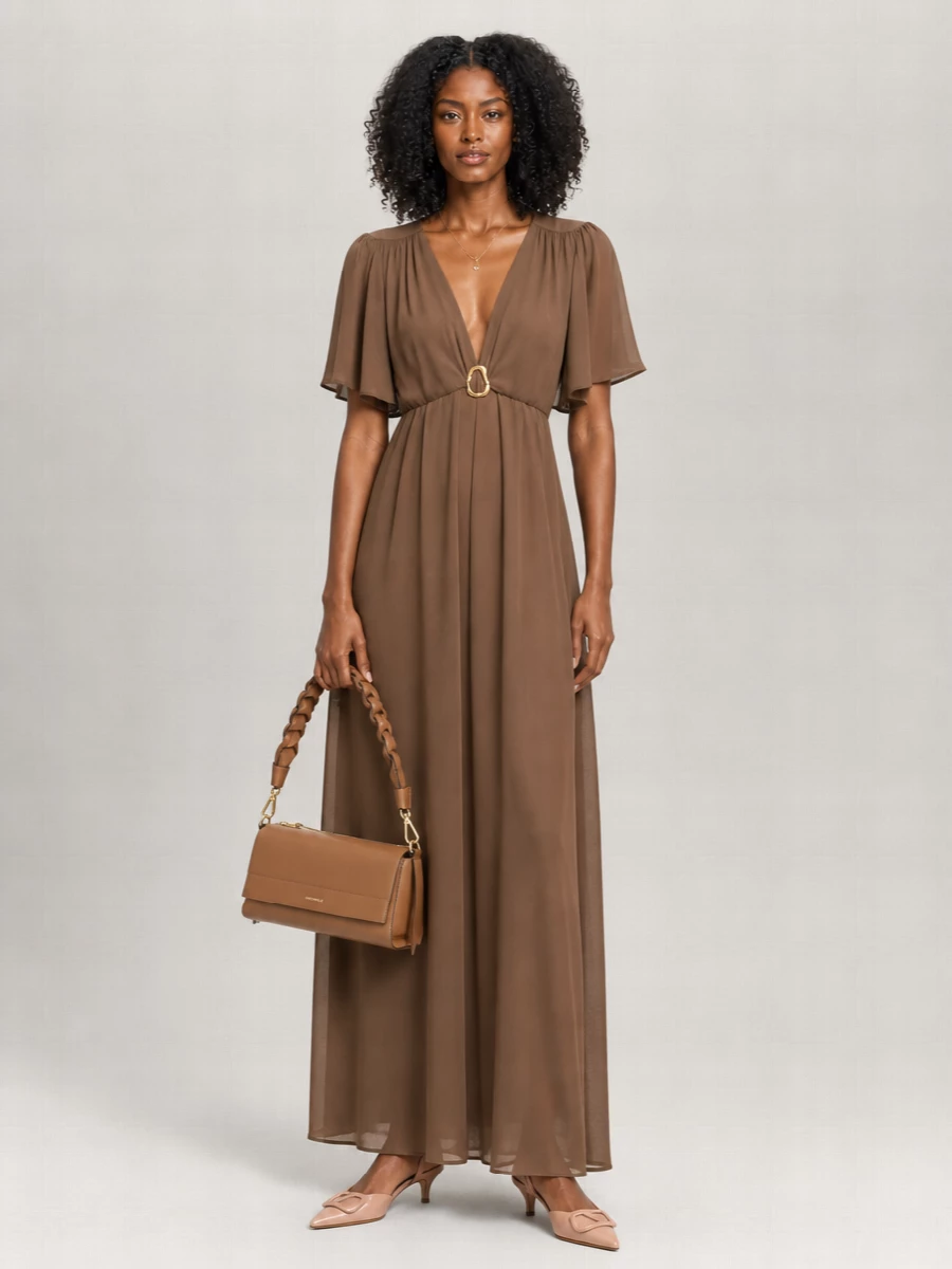 I built this around a single, long line so the Chloé necklace can read as a quiet focal point against fluid mocha satin. The Forte Forte maxi, blush Valentino slingbacks and caramel shoulder bag keep everything in a warm, romantic register that feels polished but low-key. Choosing the dress route over separates avoids competing waistlines and textures, giving a simpler column for the jewelry’s boho charm to play against.