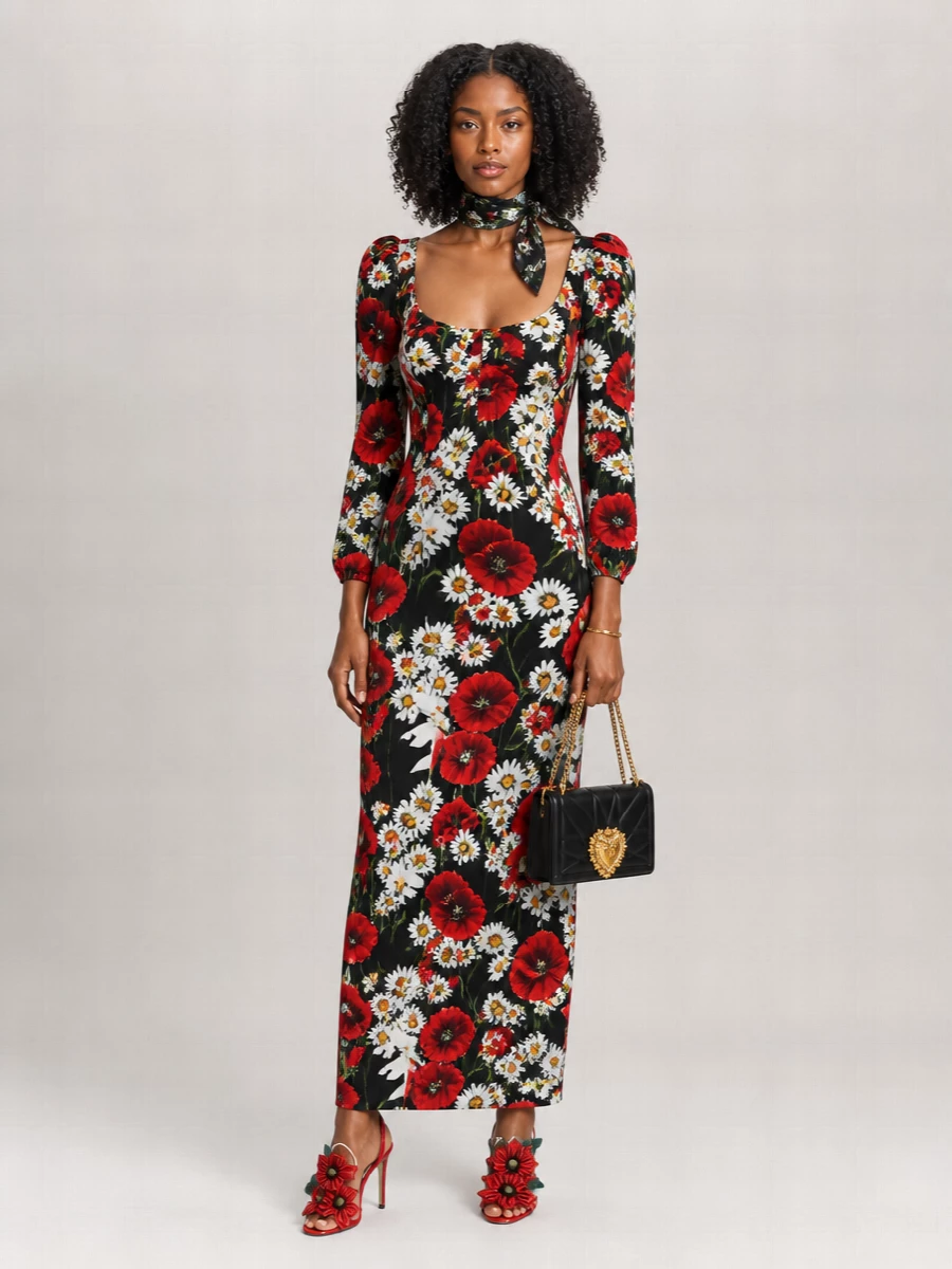 A drama-filled floral maxi is grounded with sculptural poppy slingbacks and a compact black heart-embellished bag for a pure Dolce evening moment. Gold accents stay refined and minimal so the print and 3D flowers do the talking. The result feels romantic, cinematic and sharply pulled together for summer nights out.