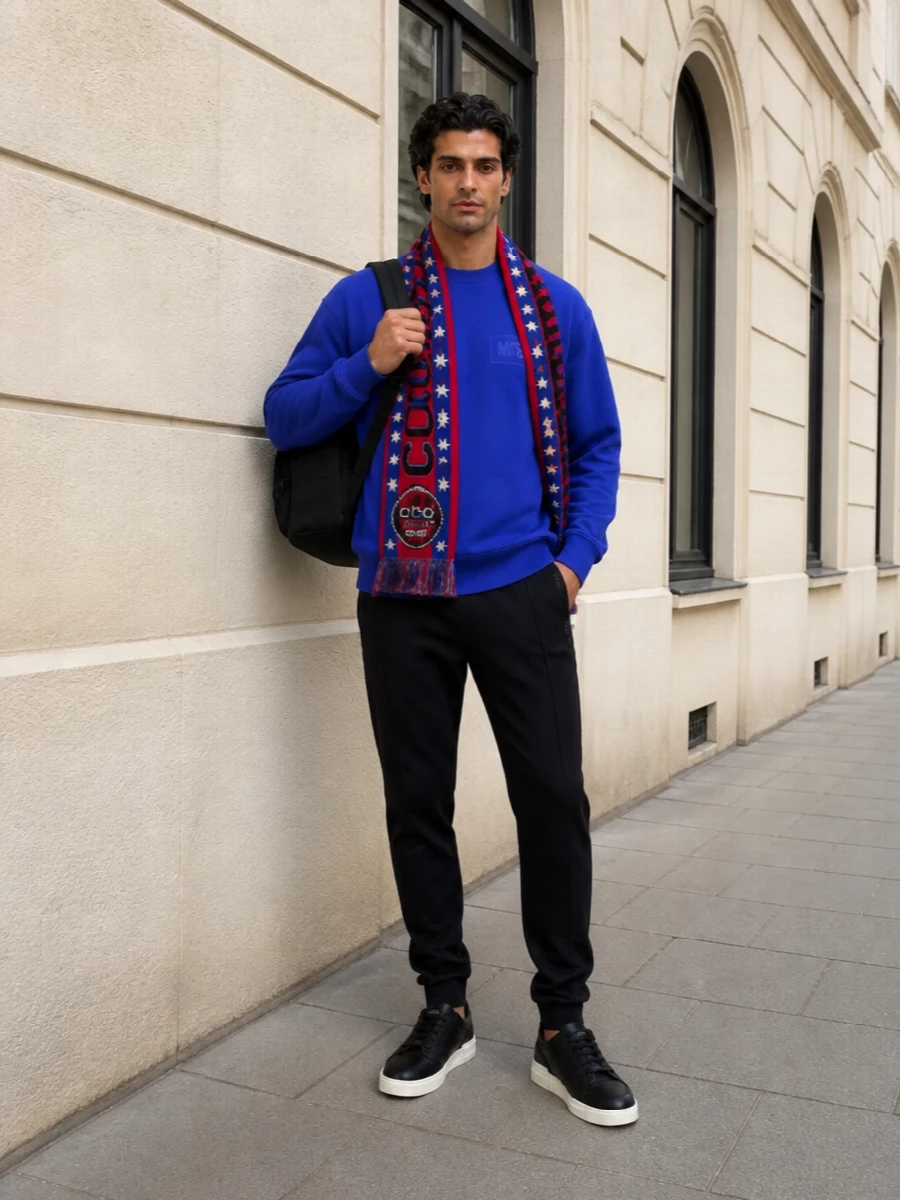 Moschino cobalt sweatshirt black track pants outfit