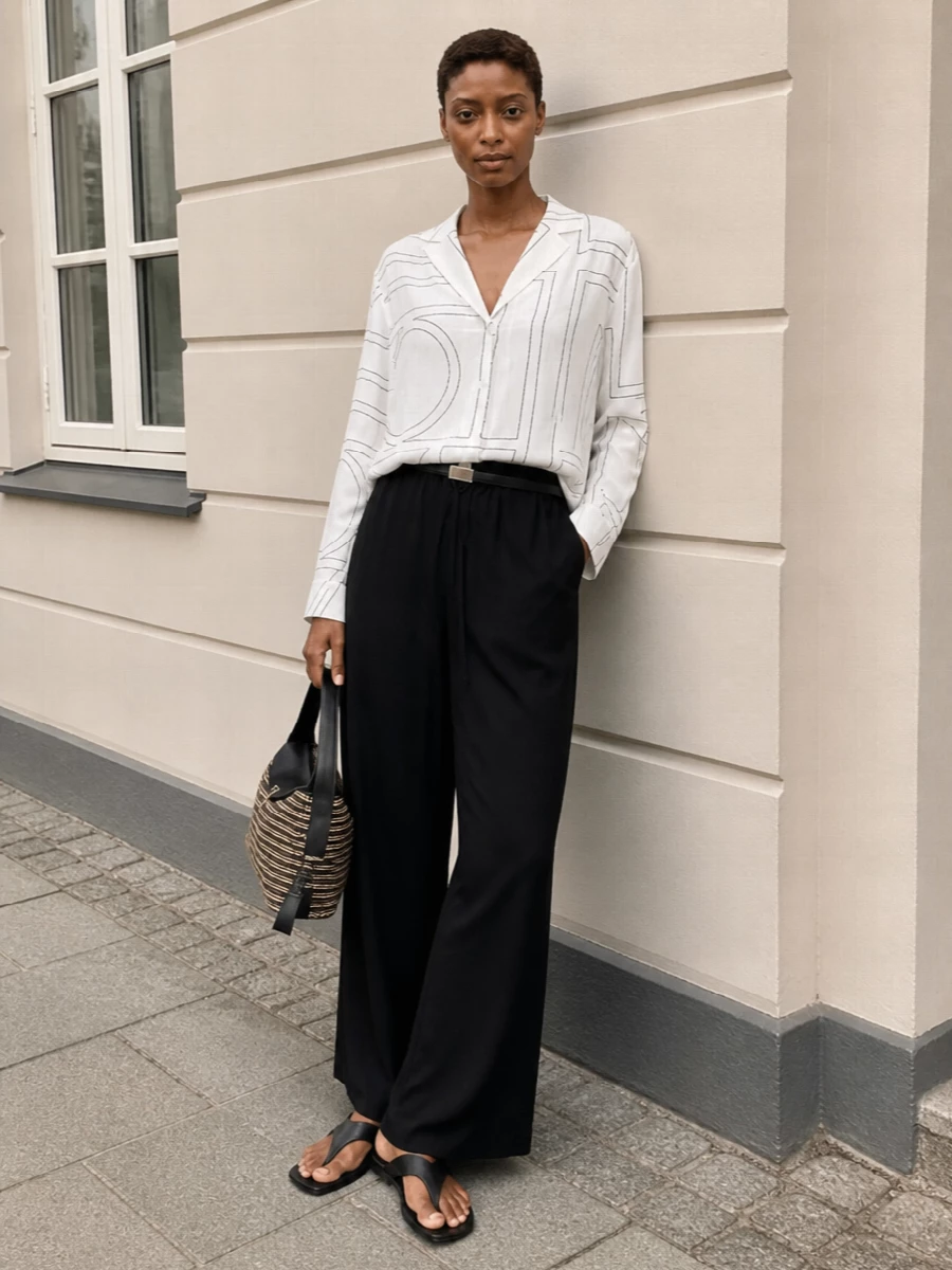 Toteme black wide leg pants white shirt outfit