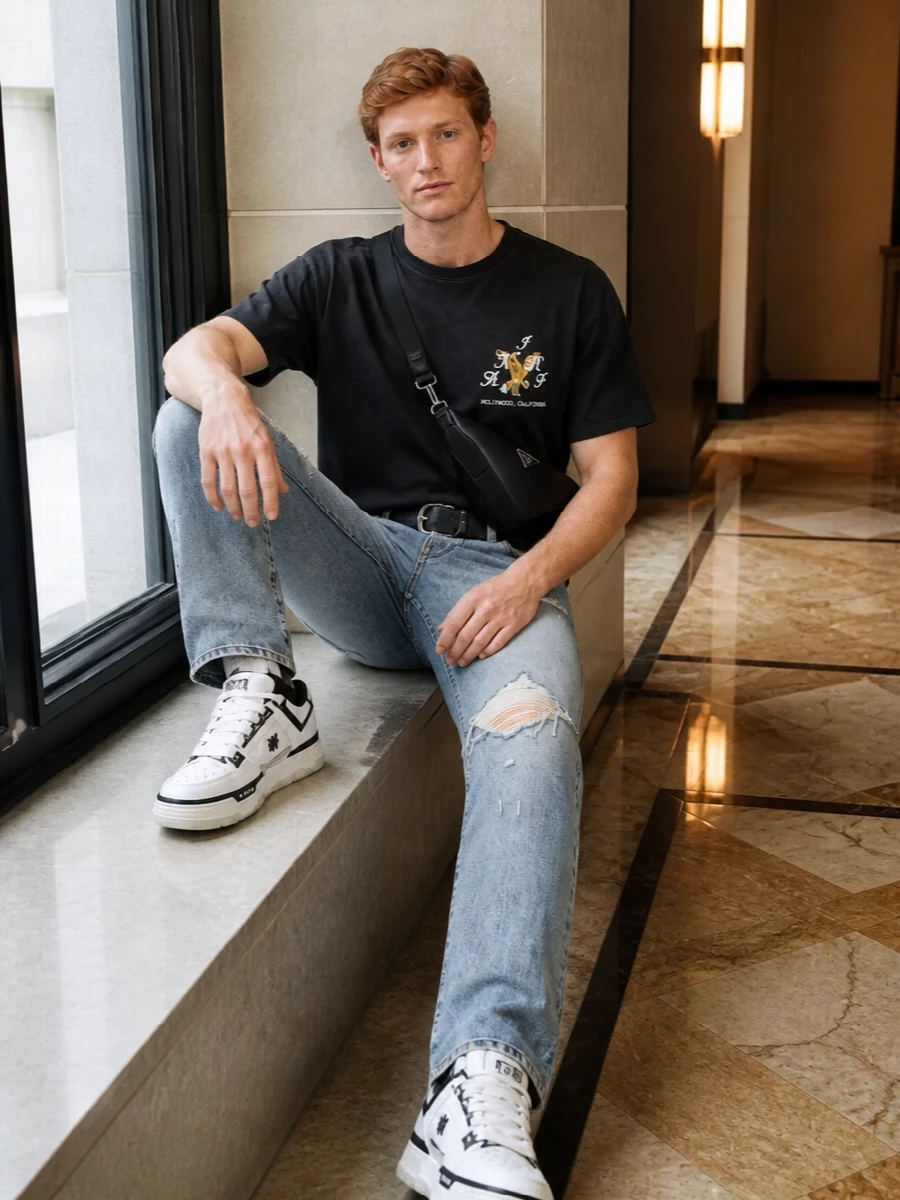 Amiri distressed jeans black tee sneakers