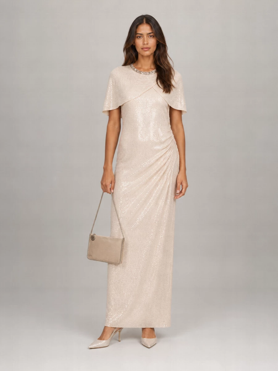 I leaned into the dress route rather than separates so the Jimmy Choo slingbacks can sit with a single, fluid column of champagne sequins for maximum quiet impact. The Self-Portrait maxi brings a romantic yet structured presence, while the Stella McCartney clutch echoes the same soft metallic glow so everything reads cohesive and formal without feeling overworked. It is a refined, preppy-leaning evening ensemble that feels perfect for weddings, galas, or champagne-hour terraces in warm weather.