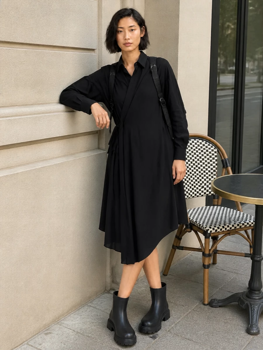 This pairing leans into a dark, directional city uniform built around the backpack’s utility energy. The Balenciaga shirt dress keeps things minimal but sculpted, while the chunky ankle boots ground it with practical, all-weather attitude. Choosing the dress route rather than separates keeps the silhouette clean and low-effort, ideal for real-life movement from commute to late-night plans.