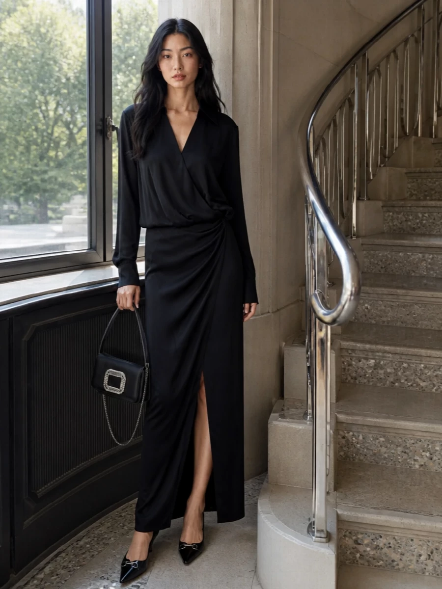 A fluid black wrap maxi from The Attico lets the Gucci kitten-heel pumps do what they do best: read impeccably polished without trying too hard. The tuxedo-inspired cut of the dress reinforces the tailored mood, while the crystal-buckled Roger Vivier bag brings a precise hit of light that speaks to the shoe’s metal detail. Choosing the dress route rather than separates keeps the line long and uninterrupted, ideal for formal dinners or gallery evenings where ease and structure need to coexist.