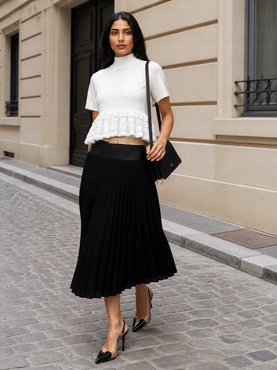 Alaia white ruffled top black pleated midi skirt