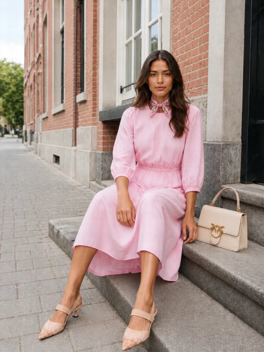 I chose the dress route so the Prada scarf can sit cleanly at the neck without competing seam lines or waist details from a separate top and bottom. The pastel Fabiana Filippi midi, Fendi kitten-heel slingbacks and buttercream Pinko top-handle create a quietly romantic, preppy city outfit in soft pinks and nudes that feels light for warm days yet polished enough for terrace lunches or client meetings. The scarf becomes the branded accent, tying the blush tones together and adding that airy, playful twist the rest of the pieces keep refined.