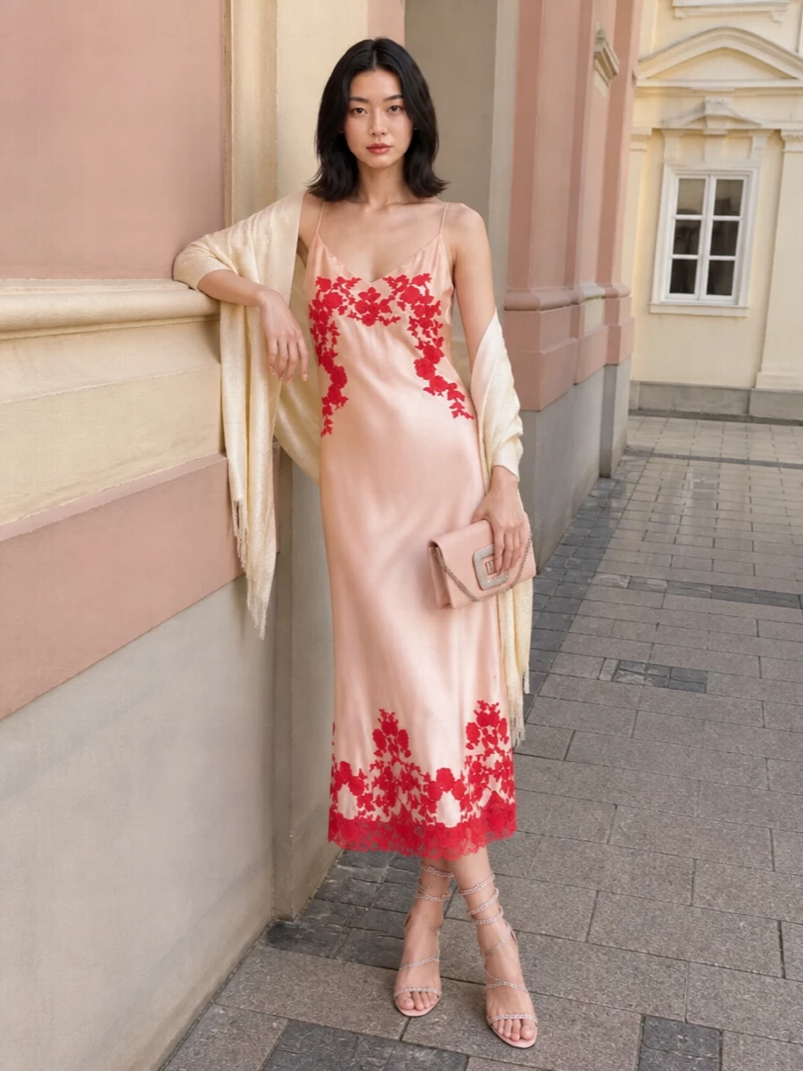 Blush, crystal and satin keep the Ermanno Scervino slip firmly in romantic, formal-evening territory, with every accessory chosen to echo its softness rather than fight it. Blush spiral sandals and a crystal-buckled clutch bring light-catching detail that feels intimate and couture, while an ivory stole is there purely for a whisper of coverage when the air cools. The result is sensual but composed, perfect for summer weddings, rooftop dinners or any night where you want the dress and your skin to do most of the talking.