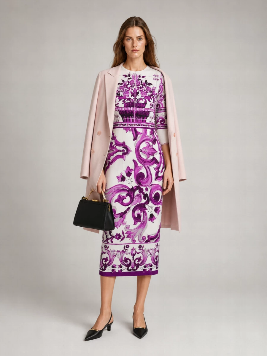 Let the baroque Dolce & Gabbana midi be the focus, framed by sleek black accents that temper the print’s drama. A sharp pointed slingback and structured clutch introduce quiet structure and a touch of gold, keeping the mood cocktail-ready yet restrained. The result is unapologetically feminine Italian glamour, edited through a minimalist lens so every line stays precise.