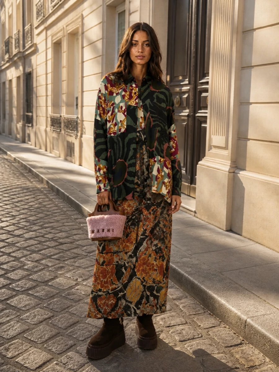 I opted for the dress route so the Dries shirt-jacket can float over a single, fluid printed column instead of competing with a separate top and bottom. The Pierre Louise Mascia maxi echoes the jacket’s artistic, patchwork florals, while the Chloé platforms and plush Marni mini bag bring cozy, romantic texture that keeps the whole ensemble grounded and richly autumnal. It feels like an artful, collector’s take on boho romance, perfect for city days that turn into soft, candlelit evenings.