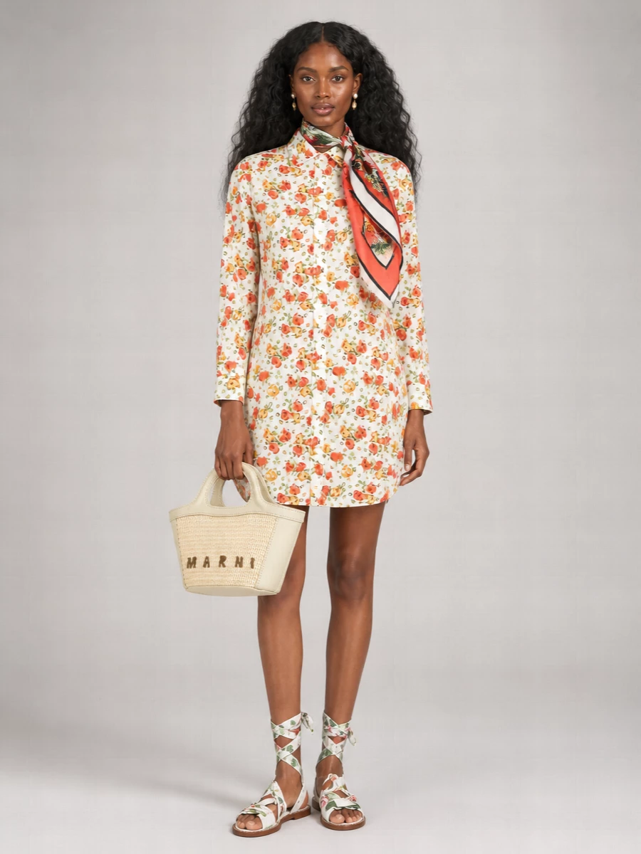 Softly romantic and city ready, this pairing leans into the floral shirtdress’s garden palette with light, grounded accessories rather than more print. Flat ankle-wrap sandals and a woven Marni tote keep the mood easy but considered, while pearl studs and a silk scarf add just enough finish for lunches, errands or a relaxed office day. The result feels bright, feminine and practical for cool-season days that still want a hint of summer.