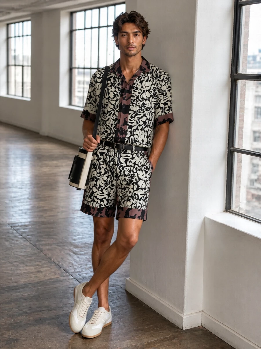 Head-to-toe Dries print turns the shorts into a matching co-ord, so the energy feels deliberate rather than chaotic. Soft off white runners and a structured canvas bucket bag dial the mood back to relaxed, art student off duty. A slim black belt quietly frames the waist so the swirling pattern can do the talking.
