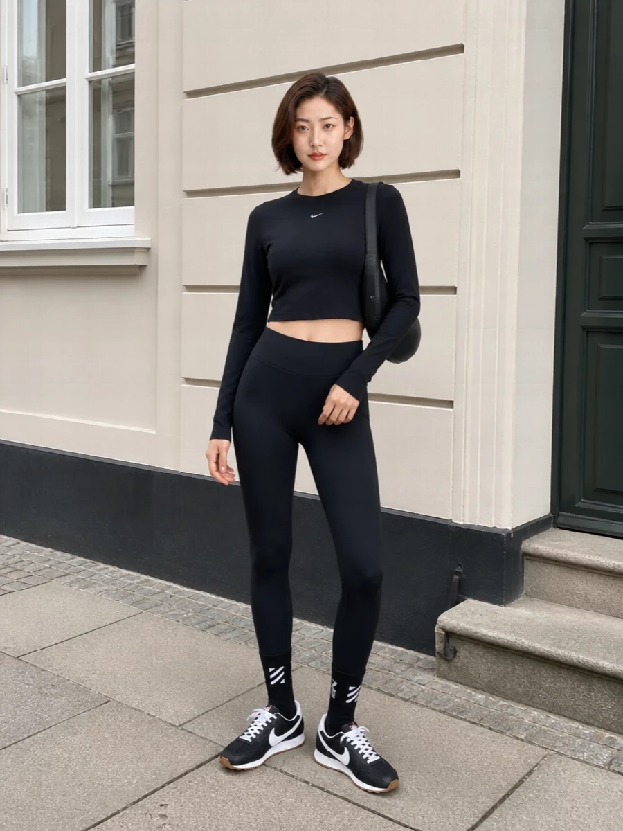Nike black crop top leggings coperni bag outfit