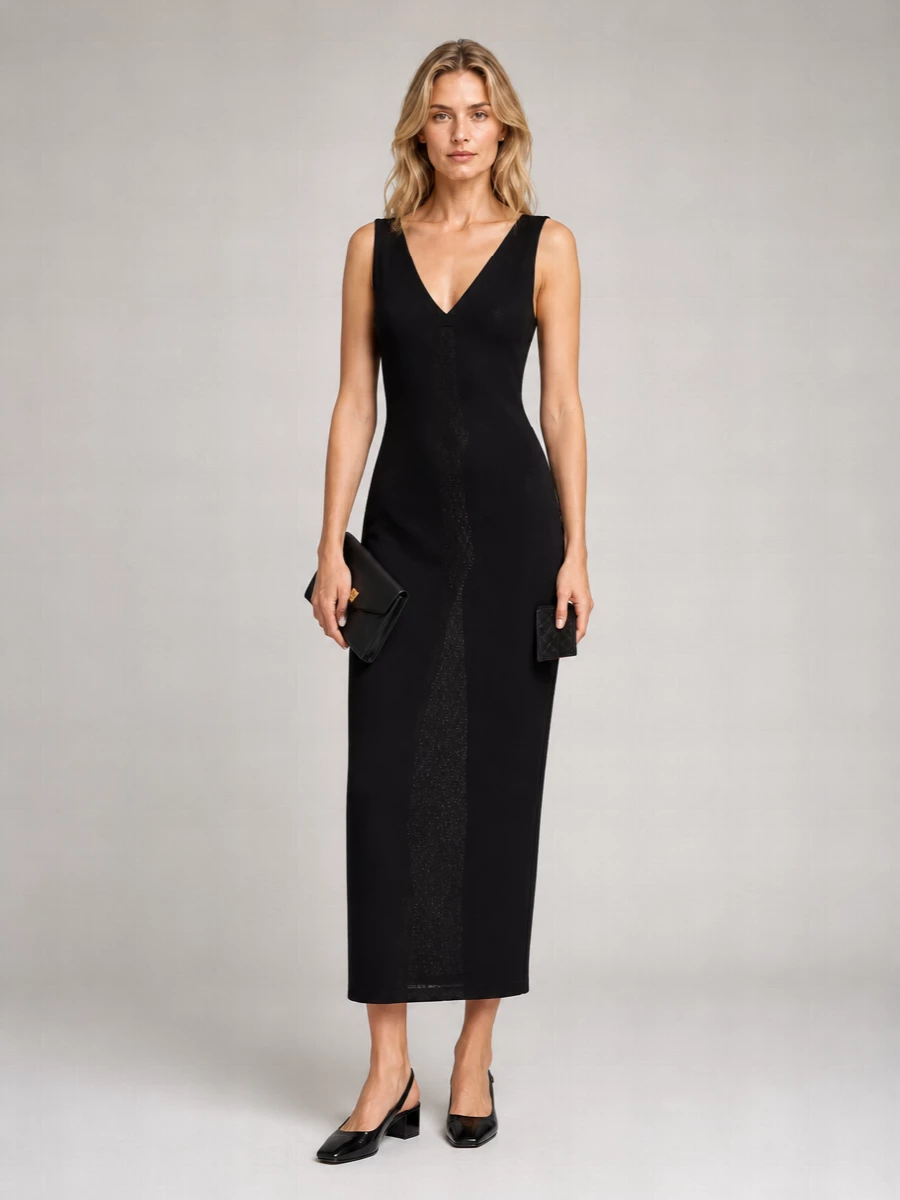 Anchoring the outfit with the Tom Ford maxi rather than separates keeps the message pure: a single, elongated black column in dialogue with the woven Bottega cardholder. The low black Courrèges slingback and the structured Versace envelope clutch add just enough hardware to catch the light while preserving a quietly expensive, near-monochrome evening mood. The result is formal, modern and intentionally restrained, ideal for nights when you want the cut and finish to speak more than any branding.