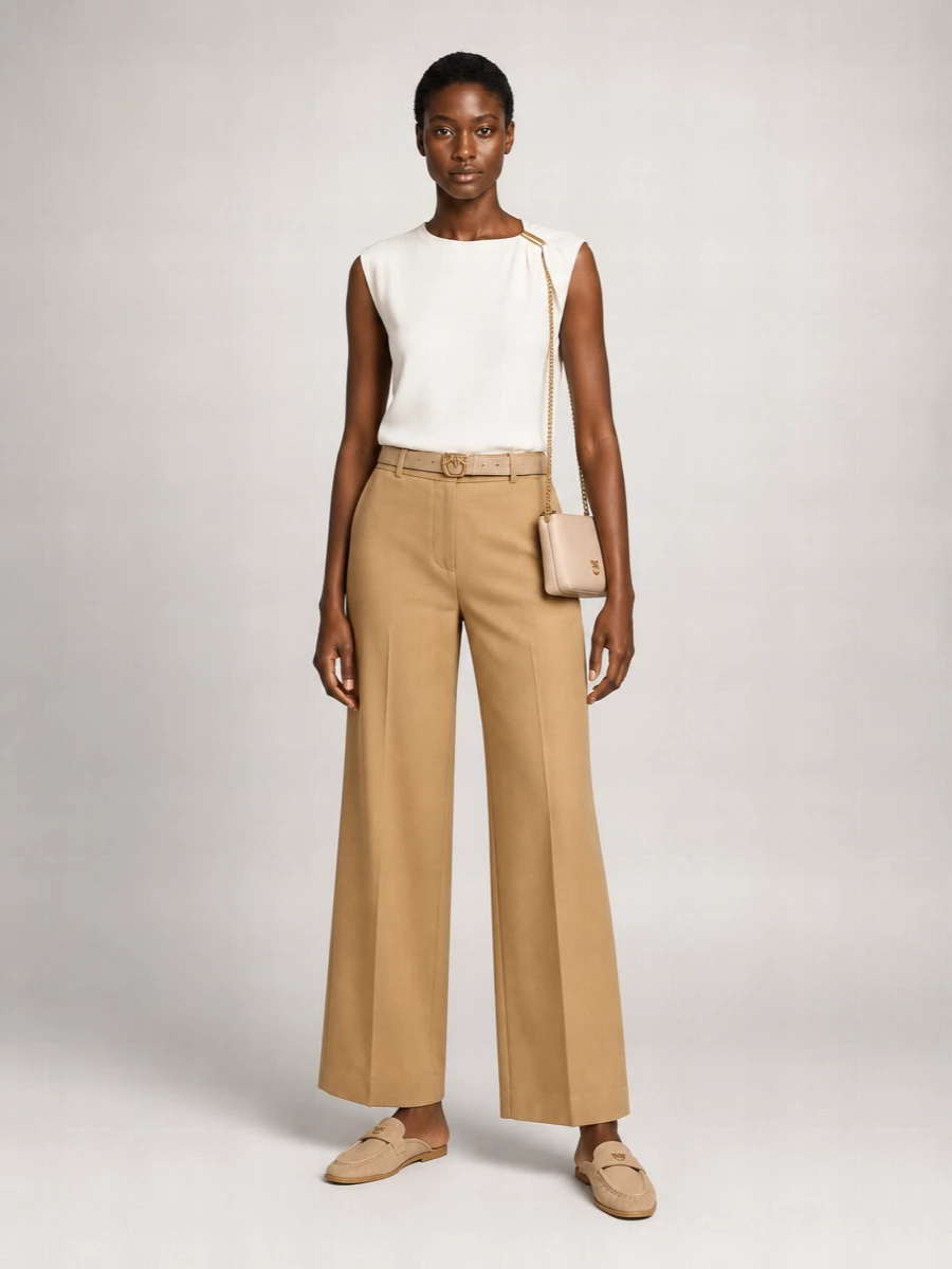 Camel wide-leg tailoring and the asymmetric ivory top create a soft, elongated line that feels quietly confident. Neutral suede mules keep the mood relaxed while the nude cross-body and slim belt add just enough structure. It is an easy neutral uniform for warm days when you still want clear intention in your outfit.
