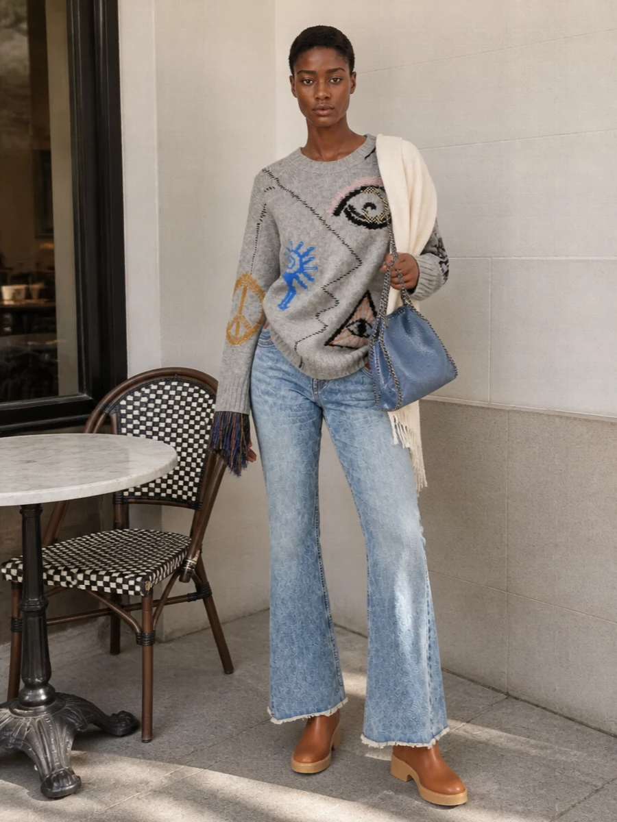 Stella mccartney flare jeans graphic sweater outfit