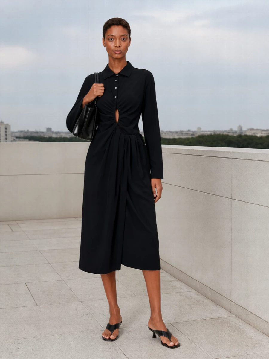A deep black Margiela shirt dress and the sculptural Hereu tote create a clean, directional evening ensemble with a quiet, architectural edge. The ruched cut-out and kitten-heel thong mule keep it sensual but restrained, ideal for gallery openings or late dinners where polish matters without feeling overworked.