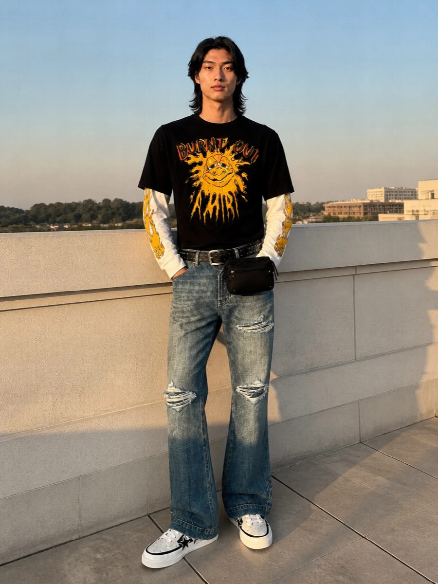 Amiri flared jeans graphic tee skate sneakers