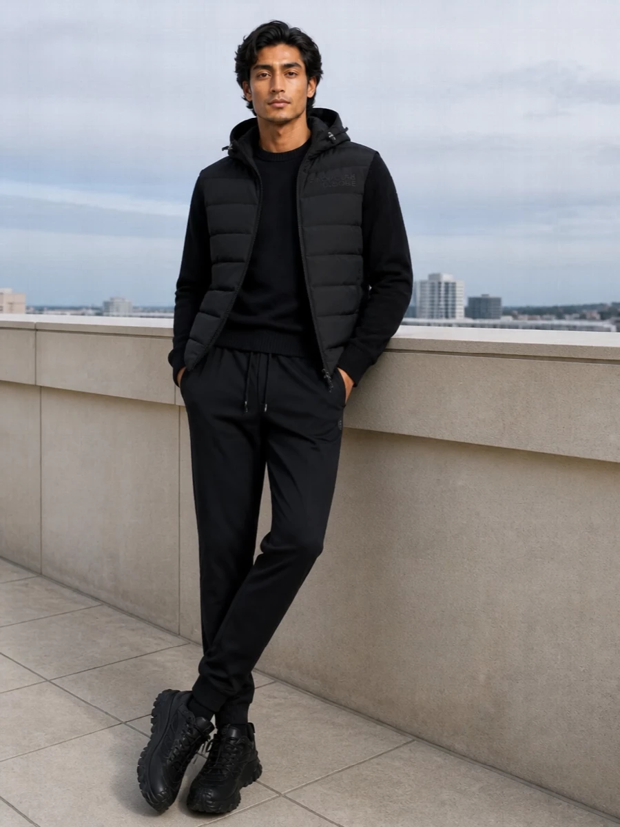 This is a stealth monochrome Moncler Grenoble set, built around the hybrid padded hoodie and framed with equally technical layers. Navy and black stay tightly controlled so the interest comes from texture and proportion, not noise. It is made for cold city days when you want real performance wrapped in a very quiet streetwear attitude.