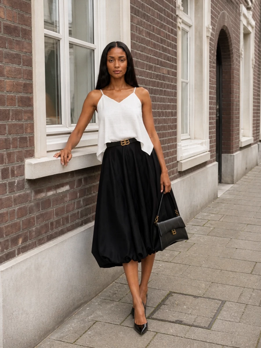 Balenciaga black midi skirt white camisole outfit