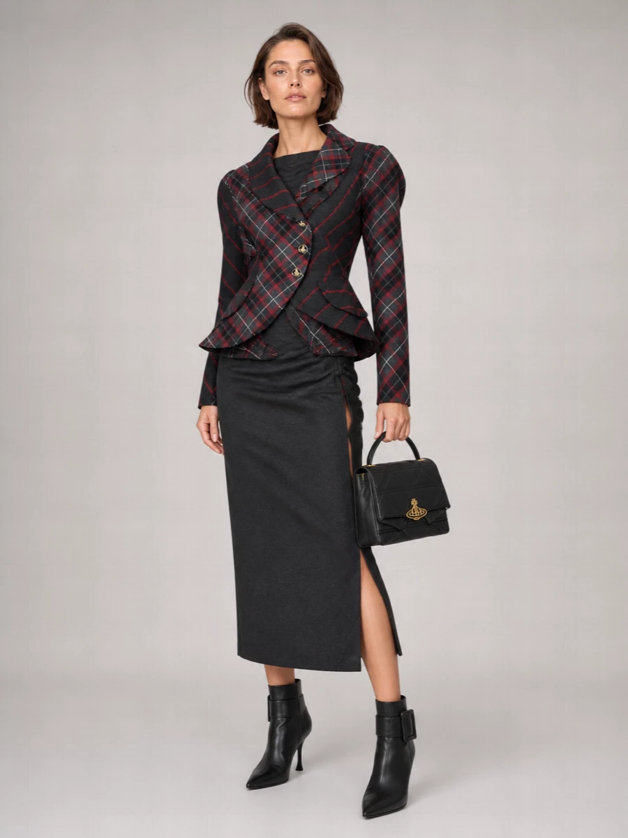 I’m building this around the dress path to avoid blazer-on-blazer conflict and let the tartan jacket work as outerwear over a single, strong tailored base. The charcoal ruched midi and pointed ankle boots carry the same sharp, sculpted attitude as the blazer while staying tonally aligned. A structured Westwood top-handle bag finishes the outfit with polished, slightly rebellious coherence that reads perfectly for city evenings and high-level dinners.
