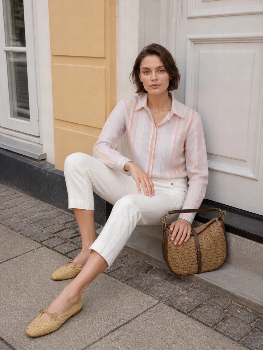 Candy-striped shirting meets soft ivory tailoring for a spring palette that feels light, pulled together and quietly playful. Neutral woven accessories in tan and straw bring a subtle boho note, keeping the focus on Etro’s print story. The result is a polished daytime ensemble that moves easily from terrace lunch to city afternoon.