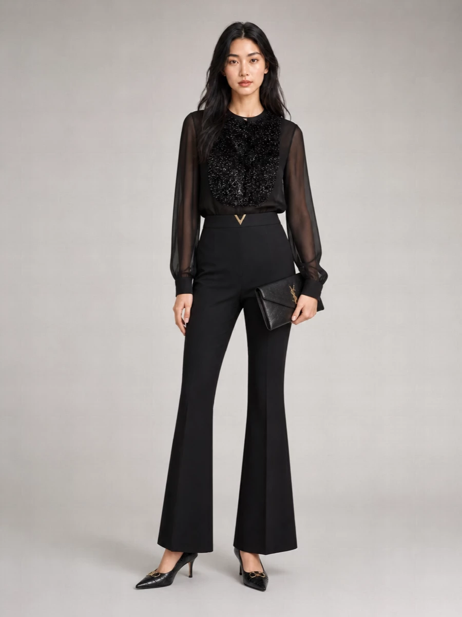 This outfit leans into a modern tuxedo mood, pairing the sheer, subtly embellished black blouse with the impeccably cut Valentino flares for a long, quiet-luxury line that flatters the mid-heel Gucci pumps. The Saint Laurent clutch keeps the hardware narrative consistent in black and gold, keeping everything polished yet understated for formal dinners or city evenings. I chose tailoring over a dress here to echo the shoe’s menswear-inflected references and to give you a more versatile, softly powerful evening option.