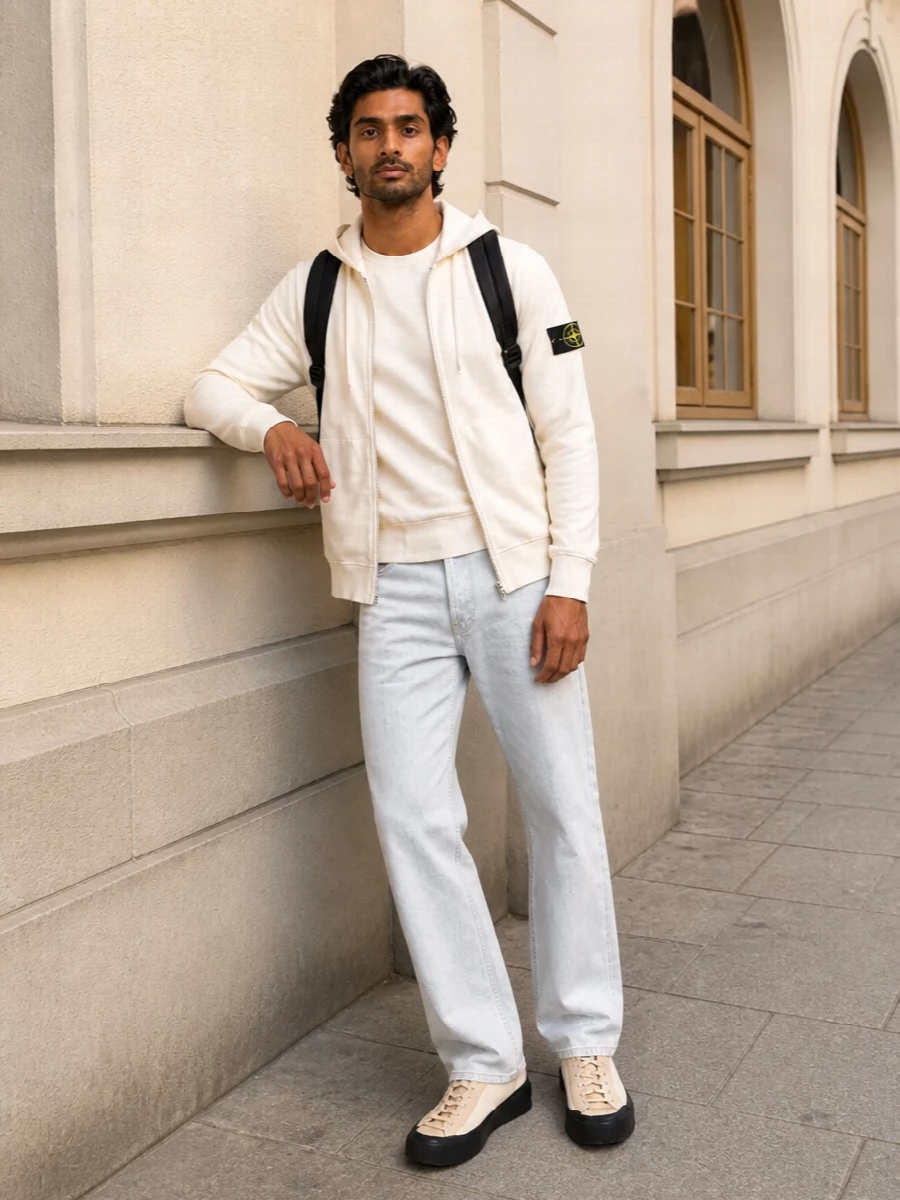 A clean Stone Island story in off-white and ice grey, grounded with black notes from badges, soles and hardware. The mix of hoodie, crew, straight denim and tech sneakers feels relaxed yet sharply put together for city days and travel. Every piece speaks the same minimalist street language, so the silhouettes can stay easy without ever looking sloppy.