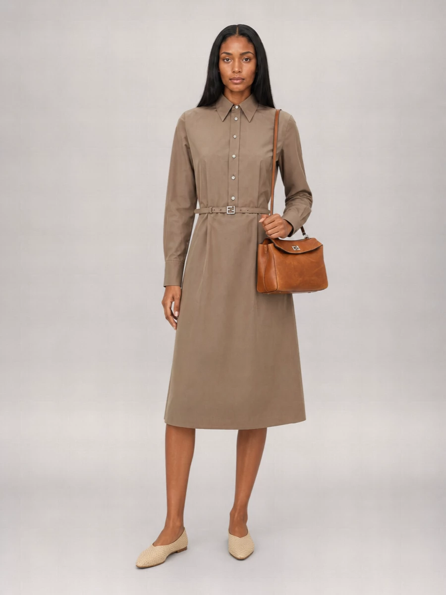 I chose the dress route to keep the Balenciaga bag’s clean, structured presence in focus and avoid overworking the silhouette with separate tailoring. The Fendi taupe shirt dress and Bottega woven flats create a quiet, elongated line in soft neutrals that sit beautifully against the cognac leather, reading polished enough for client lunches yet relaxed for late dinners. It is a precise, modern take on summer tailoring where the bag becomes the warm, structured accent against a tonal, fluid base.