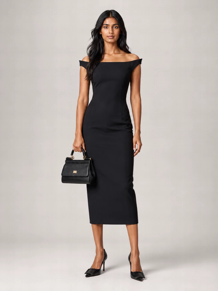 This is a strictly tailored black evening ensemble that lets the structure do the talking. The off-shoulder midi and sculpted pumps stay close to the body, so the Dolce&Gabbana top-handle reads as a deliberate, graphic accent rather than an add-on. Choosing the dress route over separates keeps the mood focused and formal, ideal when you want one clean gesture from boardroom-adjacent dinners to late-night bars.