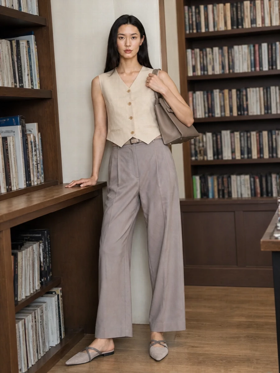 Magda butrym vest taupe trousers valextra bag