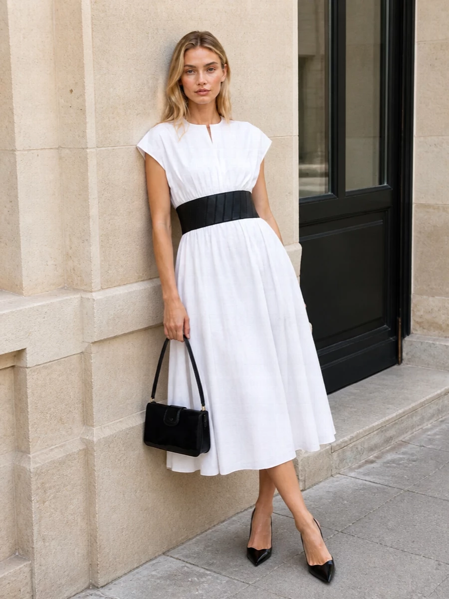 Alaia black white midi dress celine bag outfit