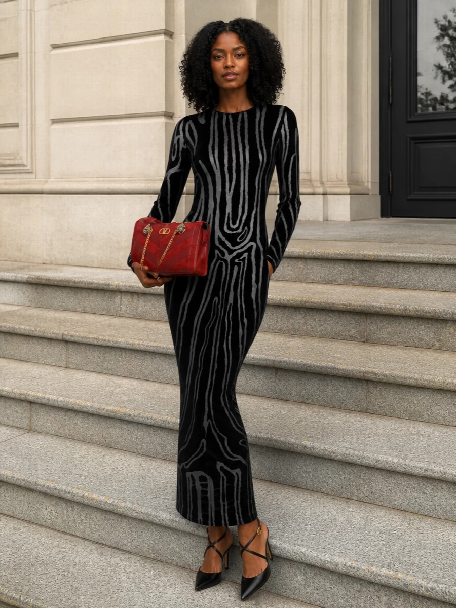 A body-skimming Balmain velvet column creates a dramatic, graphic base that stays monochrome so the Valentino bag can deliver the only hit of saturated red. The razor-sharp black Gianvito Rossi sandals continue that long, lean line, keeping the mood polished and nocturnal. I chose the dress route over separates to maintain a single, uninterrupted silhouette that feels more in step with the bag’s rock-chic yet quietly luxurious attitude.