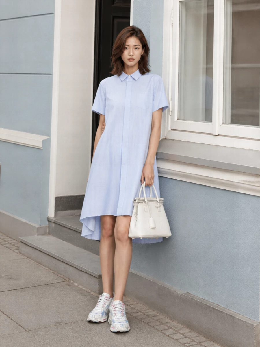 I chose the dress route, as the Sacai shirt dress mirrors the sneakers’ sport-preppy attitude and light palette more cohesively than pairing separate top and bottom. The result is a clean, modern take on a shirtdress-and-trainer pairing, with the pleated hem and asymmetric volume giving the chunky Y2K runner something architectural to play against. Margiela’s structured white bag sharpens the silhouette just enough, keeping the whole outfit in a quiet-luxury register rather than full street branding.