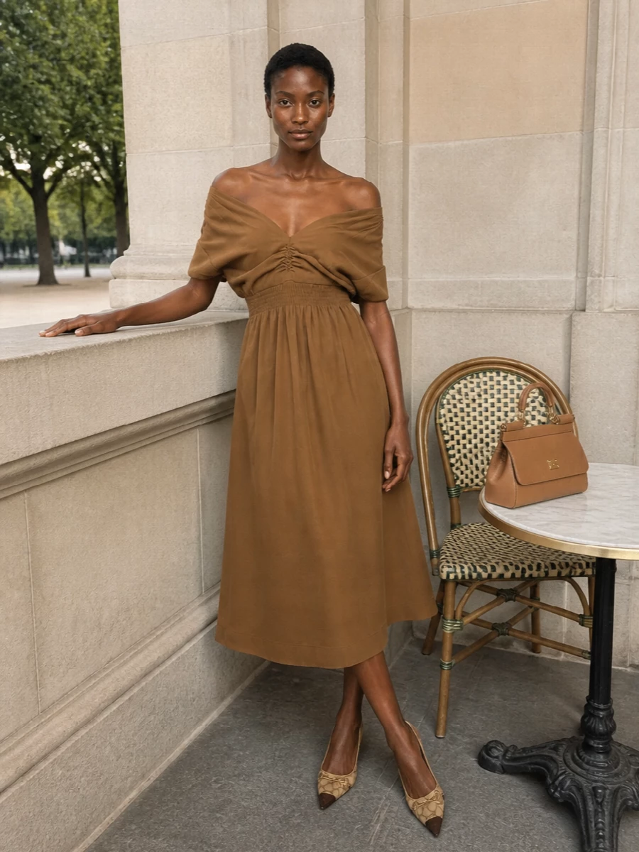 A camel off-shoulder midi and the structured bag create a monochrome column that feels quietly sensual yet impeccably composed for autumn dinners or important meetings. The GG slingbacks introduce a subtle logo accent and a sharper line at the foot, keeping the whole outfit firmly in the tailored, quiet-luxury space rather than overt cocktailwear. Choosing the dress route here keeps the focus on a single, uninterrupted neutral silhouette that speaks directly to the bag’s ladylike structure.