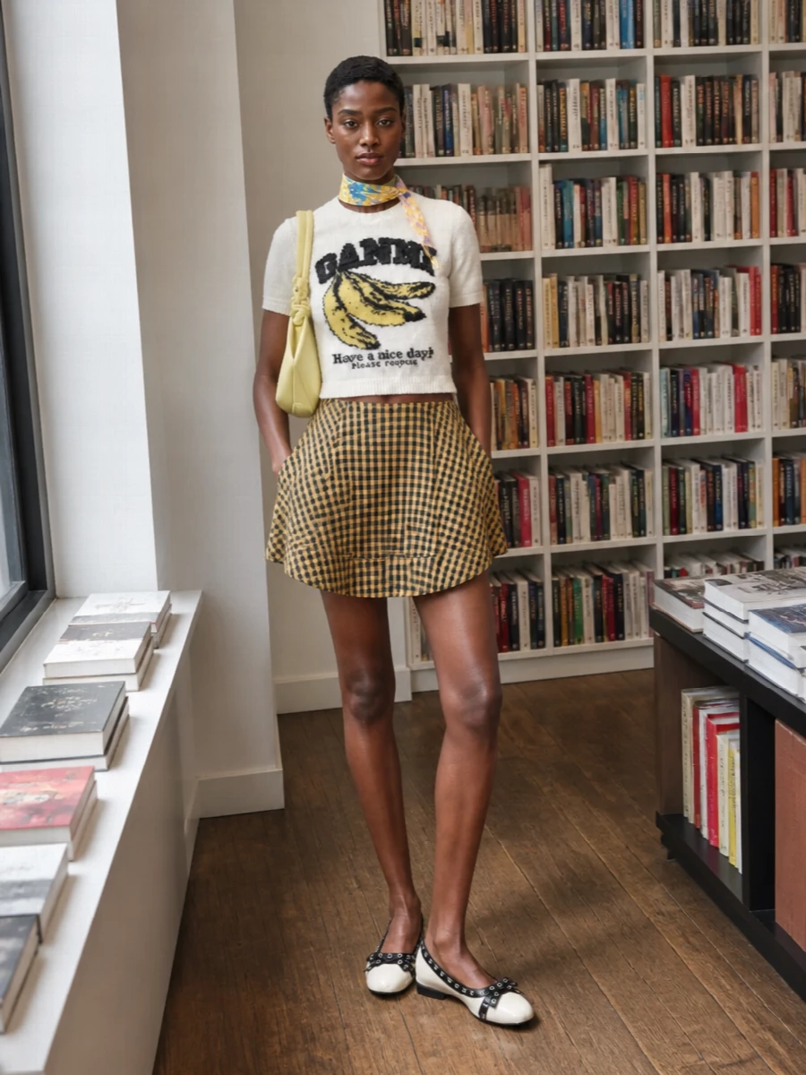 Ganni checked mini skirt graphic knit outfit