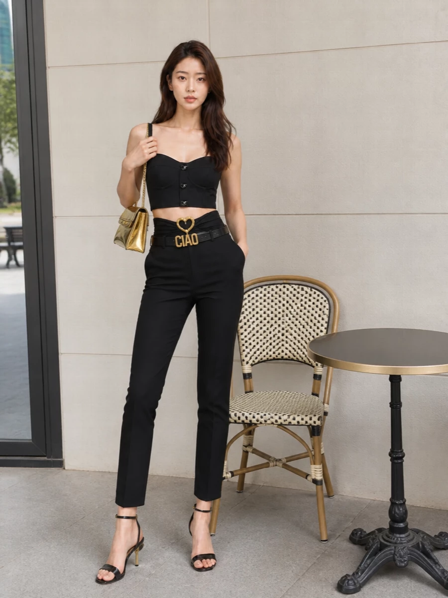 Moschino black bustier gold heart trousers outfit