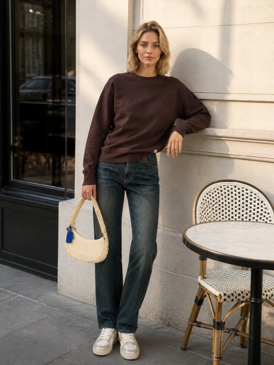 Grounded in the Golden Goose sneakers, this pairing of cocoa Saint Laurent sweatshirt and Magda Butrym faded charcoal denim hits that sweet spot between relaxed and refined. The Off-White buttercream shoulder bag keeps the palette soft and urban, with a subtle streetwear twist that still feels grown up.