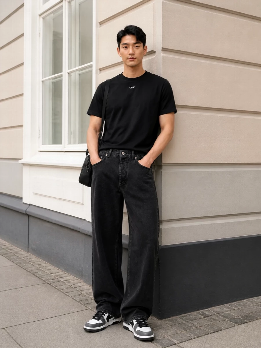 A strict black and white story keeps this Off-White set sharp, letting the wide-leg denim carry all the movement under a disciplined tee. Graphic sneakers and a streamlined shoulder bag keep the energy street, not sloppy, with logo hits that read considered rather than loud. It is an easy city uniform for cooler months that feels fashion-aware without trying too hard.