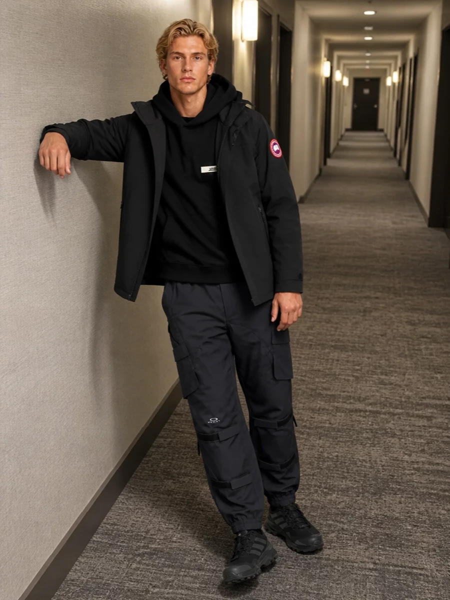 A city-ready cold weather setup that leans into technical utility, this pairing keeps everything in a restrained black and charcoal palette around the Canada Goose shell. The Jacquemus hoodie and Oakley cargos handle warmth and movement, while Adidas trail sneakers and the Emporio Armani hybrid pack turn commutes and travel into something you can actually live in all day.