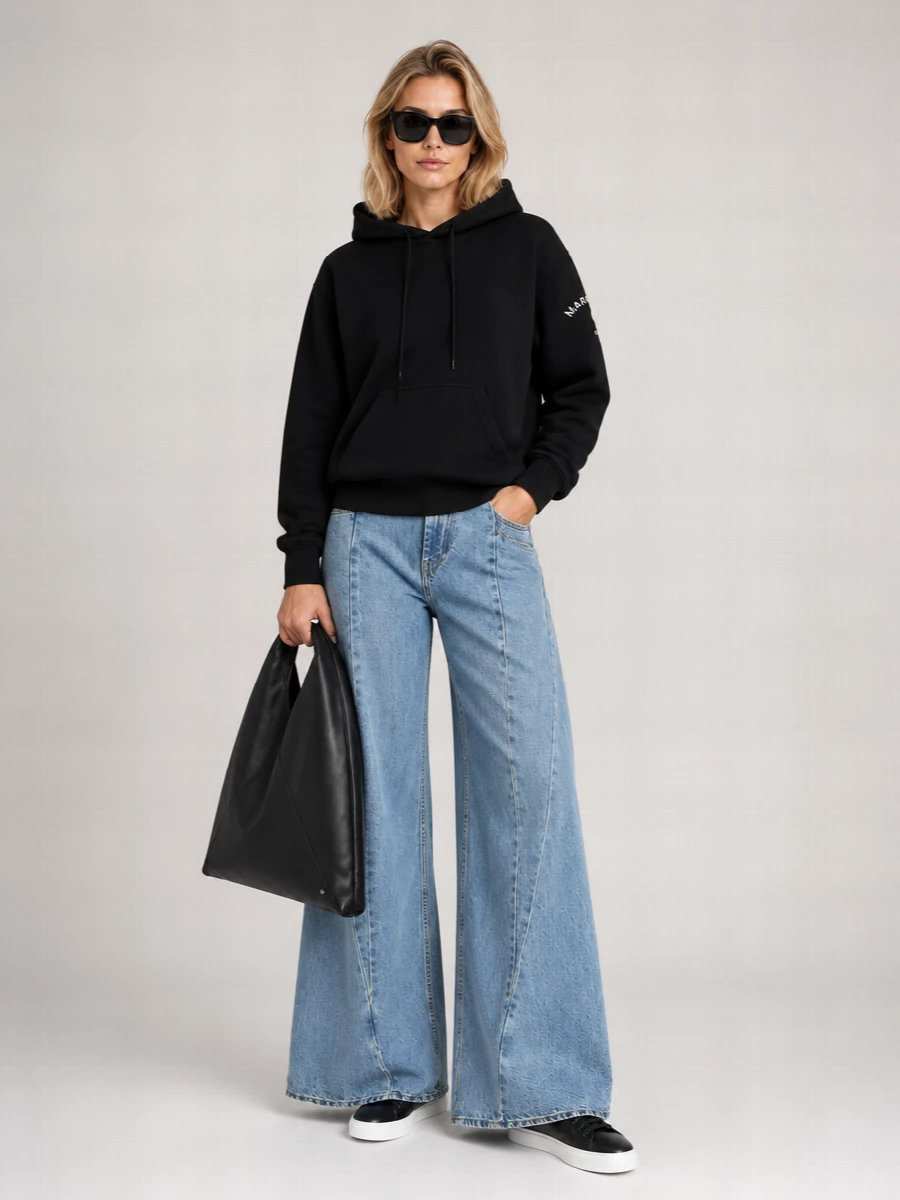 I’m taking the hoodie and wide-leg denim route rather than the dress options, so the Fendi sunglasses can sit in their sweet spot of street-lux polish. The Mm6 hoodie with Margiela’s ultra-wide jeans creates a strong, architectural volume through the leg that the sharp frames and black leather sneakers neatly contain. The Mm6 Japanese bag finishes it with a graphic, utilitarian edge that feels considered but relaxed for city days year-round.