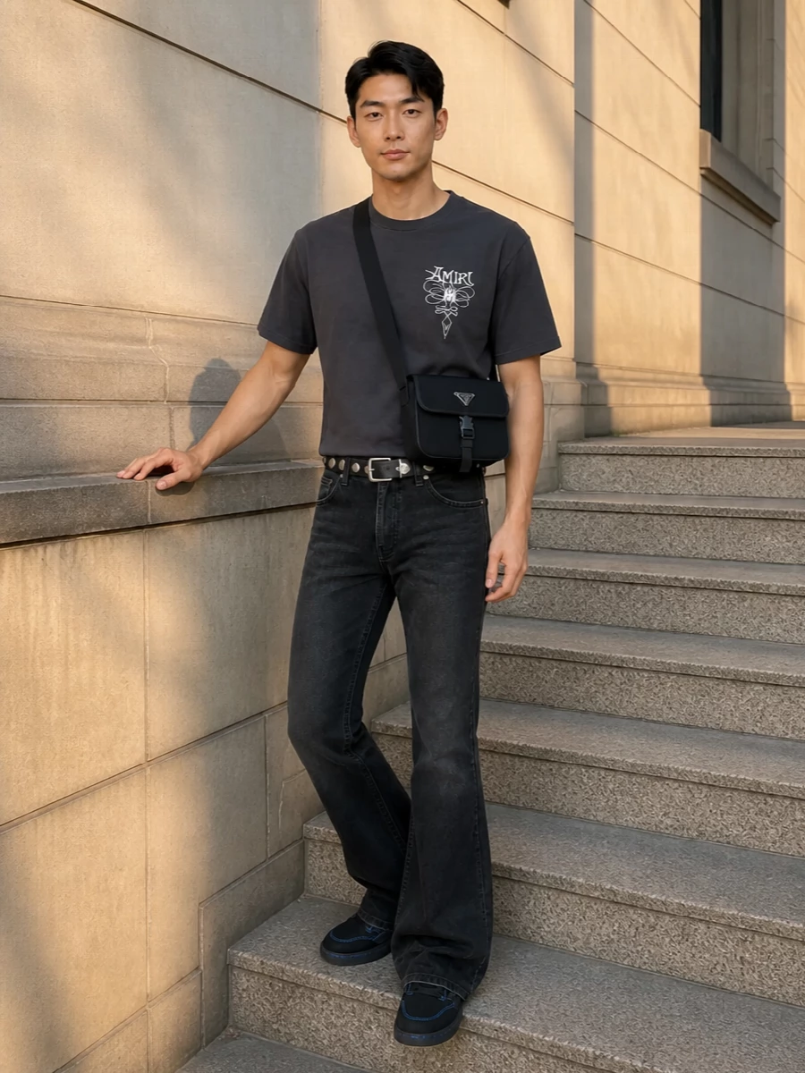 Amiri black flared jeans charcoal tee prada bag