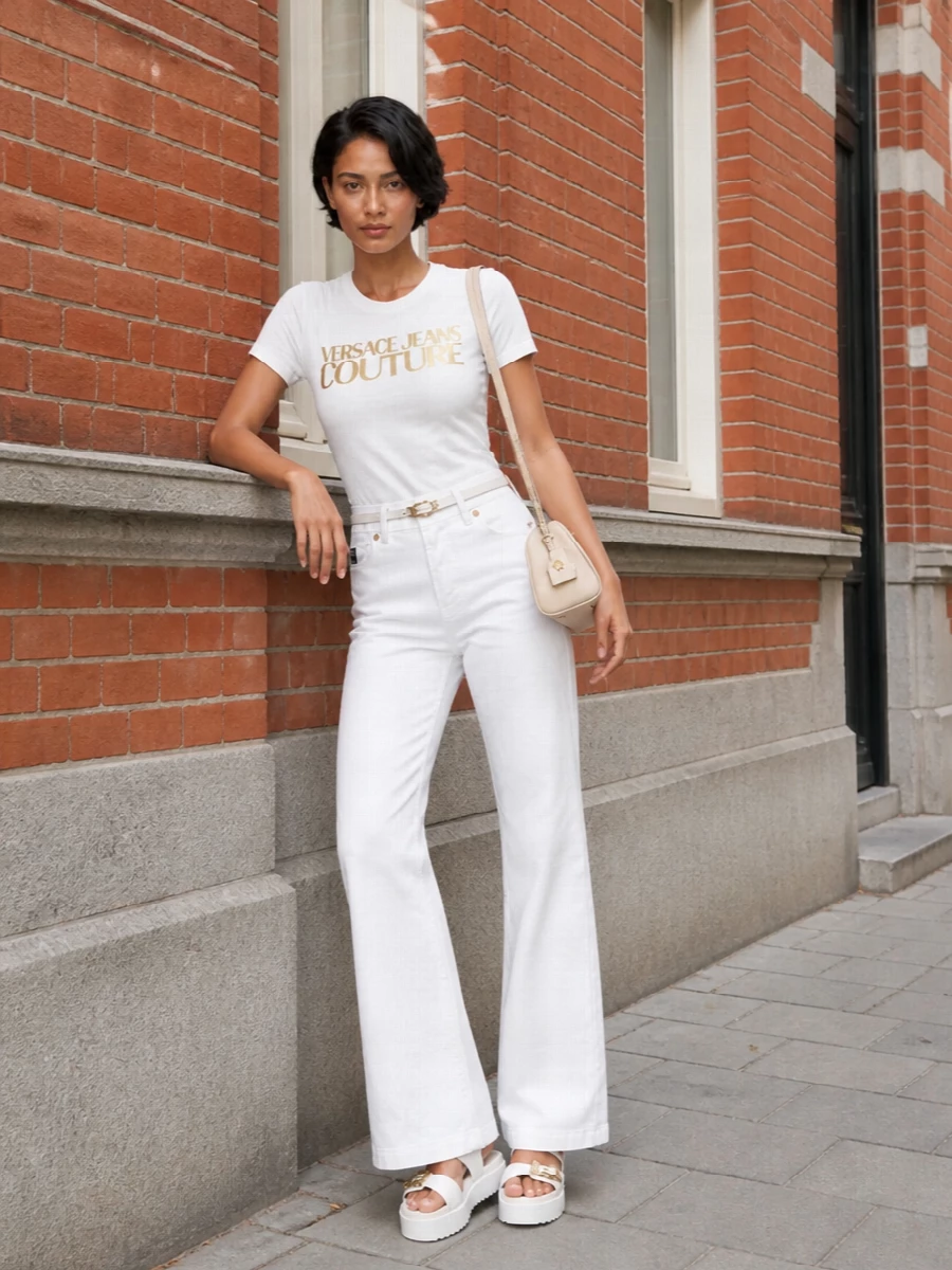 Versace white wide leg jeans gold logo tee outfit