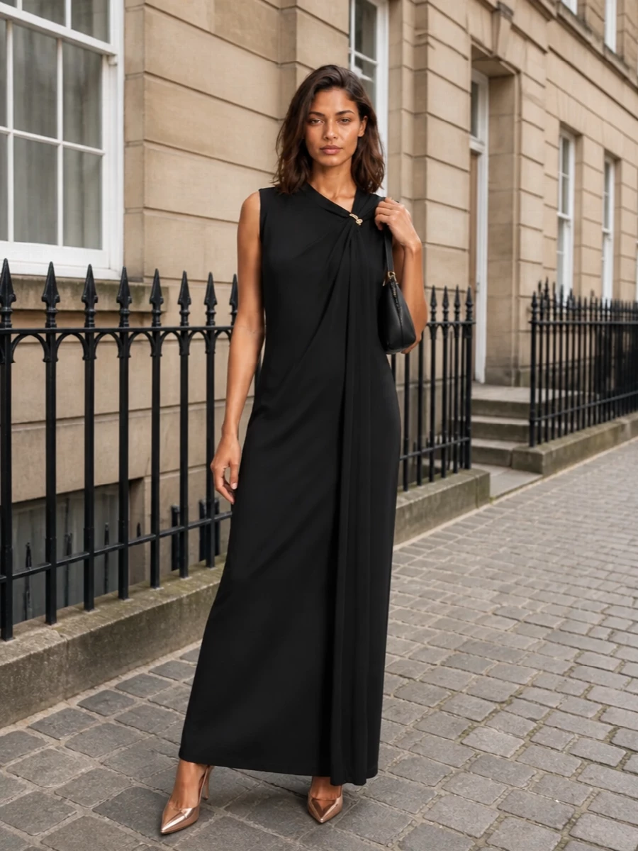 This pairing leans into a pure evening column: inky black with a single sweep of rose-gold at the feet for a quietly opulent contrast. Choosing the dress path keeps the mood grown up and streamlined, letting cut and subtle gold detailing do the work instead of extra separates. The result is a formal, romantic silhouette that feels current yet restrained around the metallic Louboutin pump.