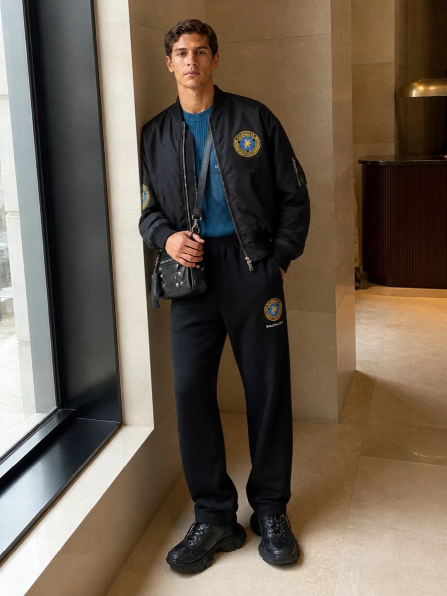 Balenciaga crest bomber black track pants outfit