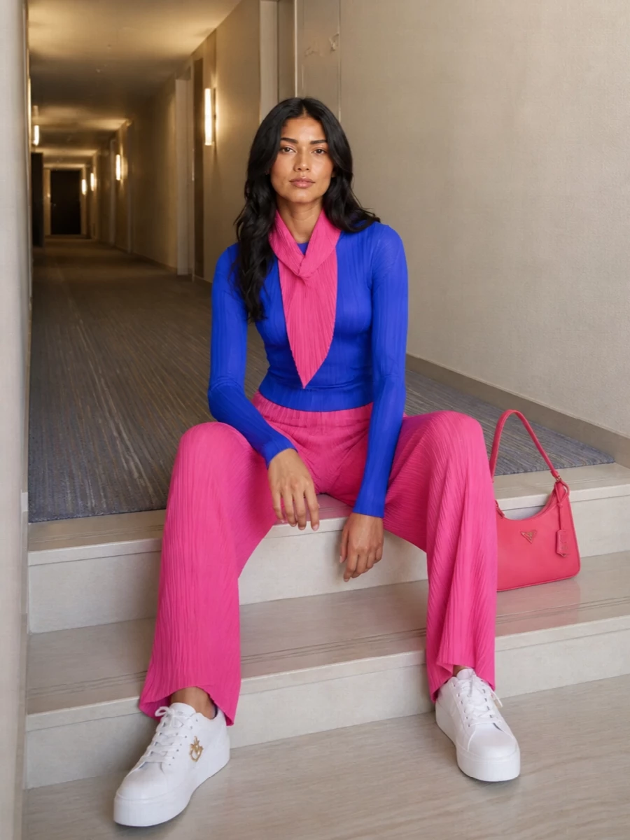 Pleats please pink trousers cobalt top prada bag